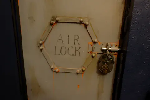 A locked rusty airlock door